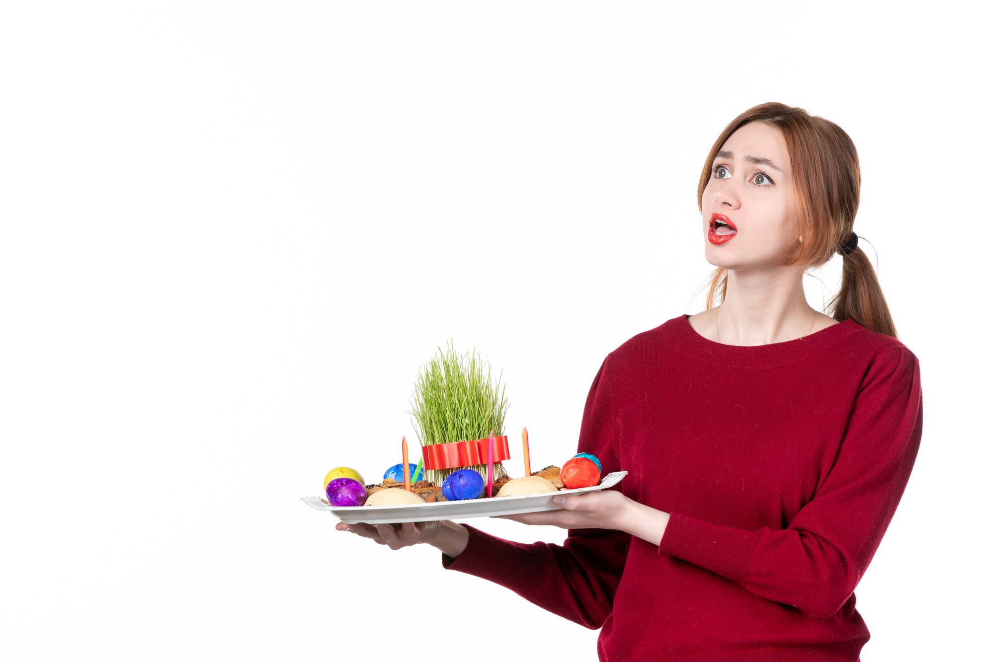 Student plating a colorful salad